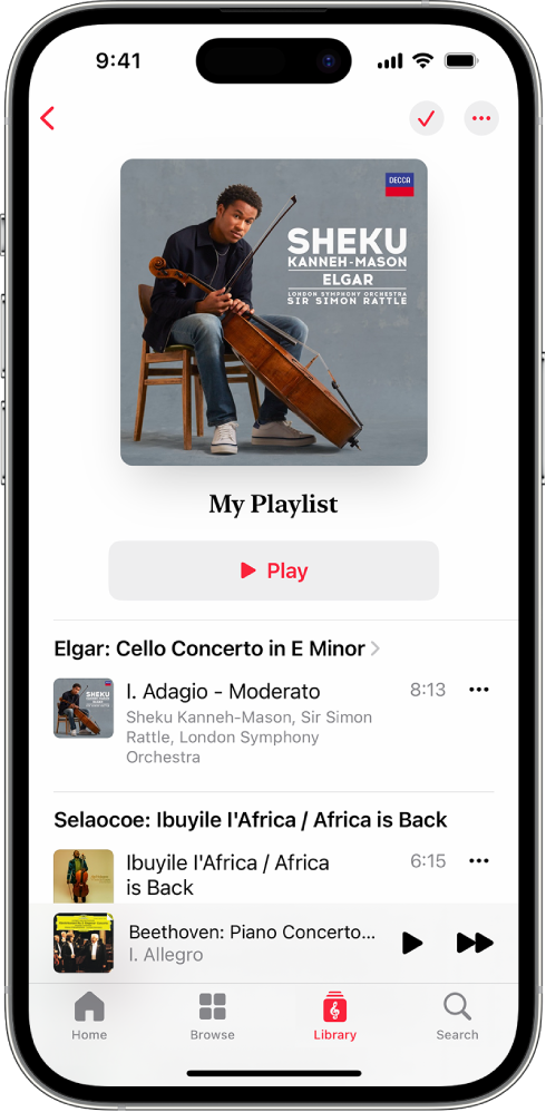 An iPhone showing a personal playlist in Apple Music Classical. At the top of the screen are album art, the name of the playlist and a Play button. The Mini Player is near the bottom of the screen, and shows the track that’s currently playing. Below the MiniPlayer are the Home, Browse, Library and Search buttons.