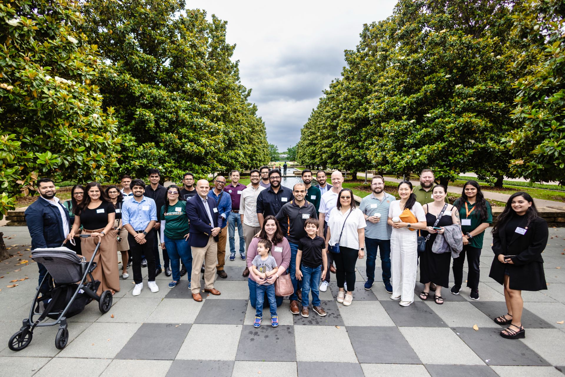 JSOM Alumni posing in the chess plaza