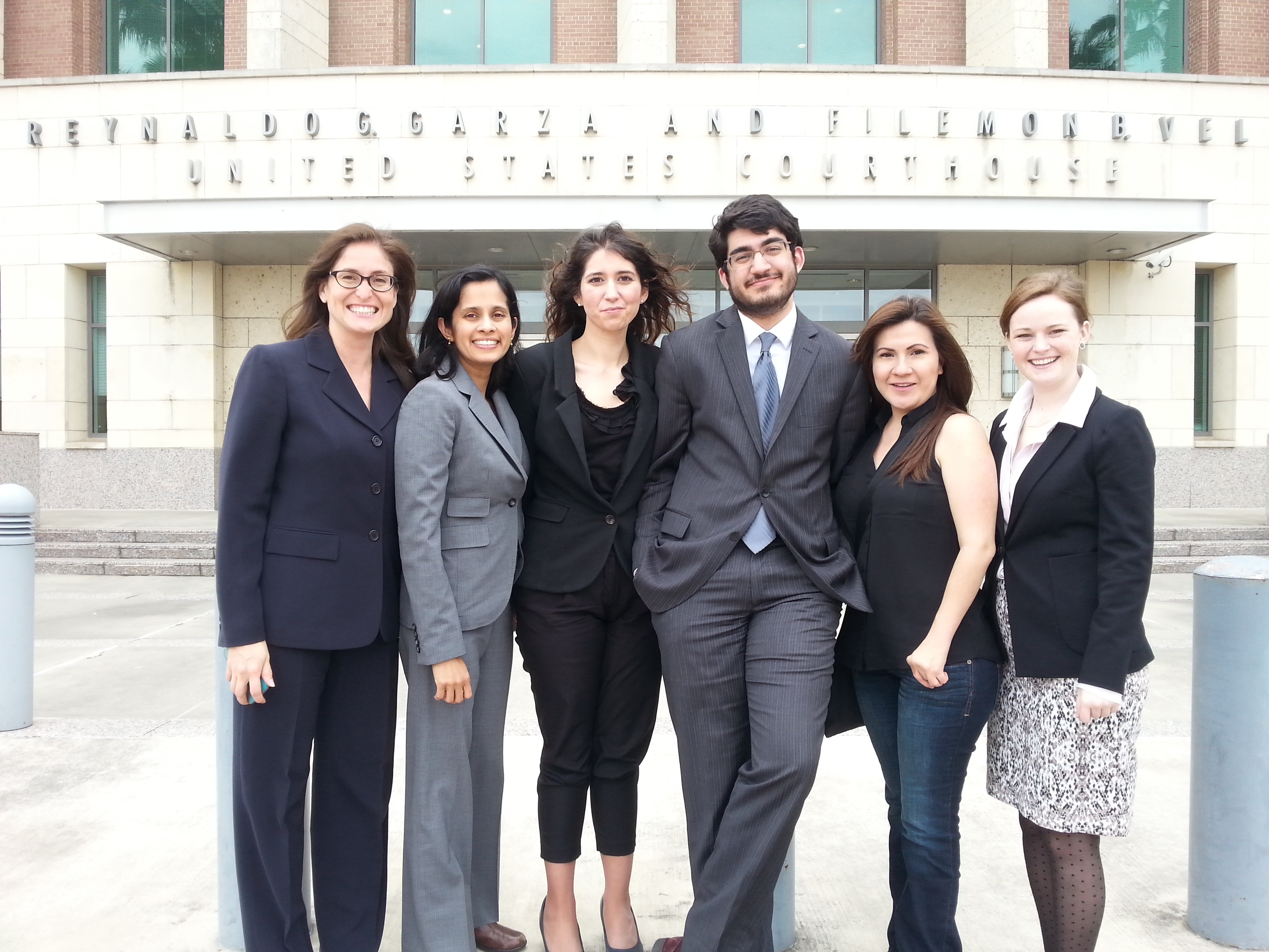 Students and faculty standing in front of courthouse