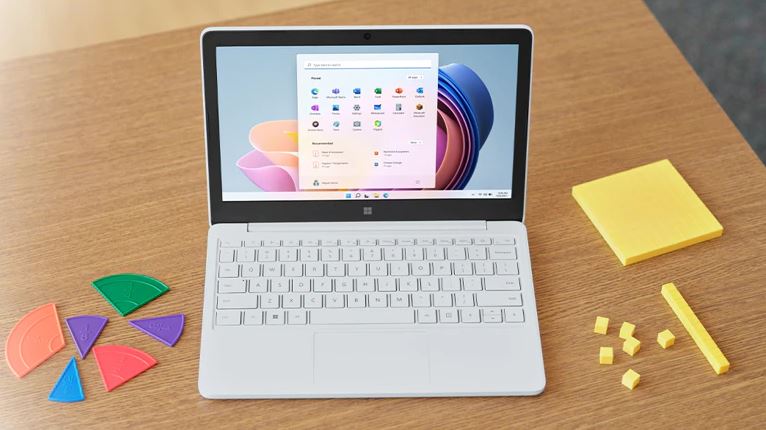 Windows 11 on a desk with math manipulatives