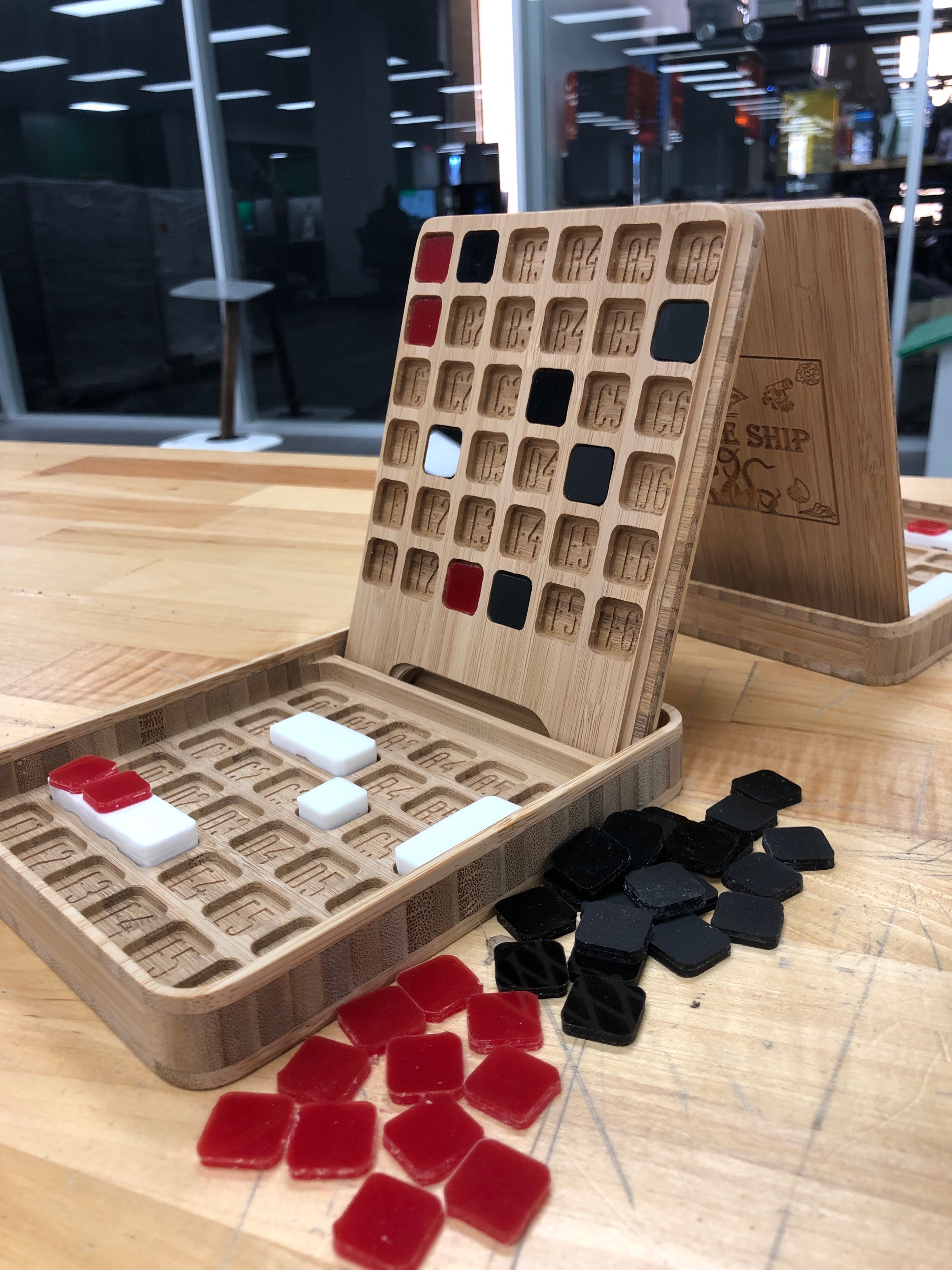 CNC carved battle ship style game in wood with coriander tiles