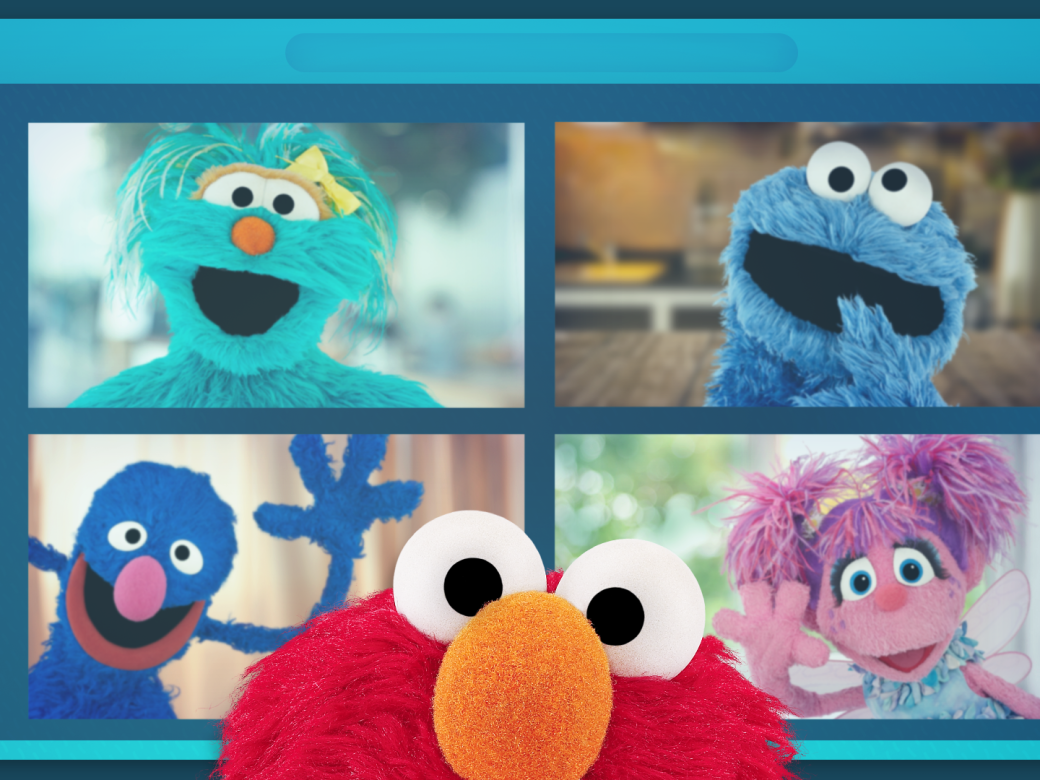 A tablet screen with a video call featuring Rosita, Cookie Monster, Grover, and Abby. Elmo peeks up from the bottom of the image.