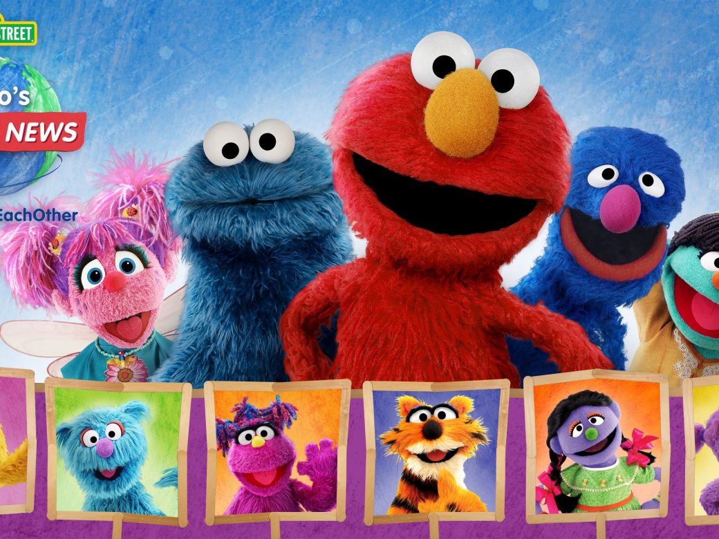 Abby, Cookie Monster, Elmo, Grover, and Raya pose with their hands on their hips.