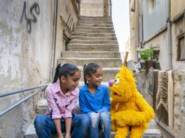 Kids on steps with Jad.