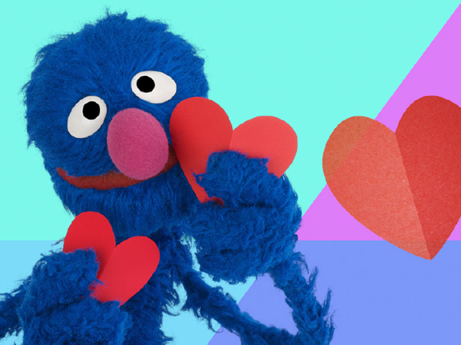 Grover holding hearts