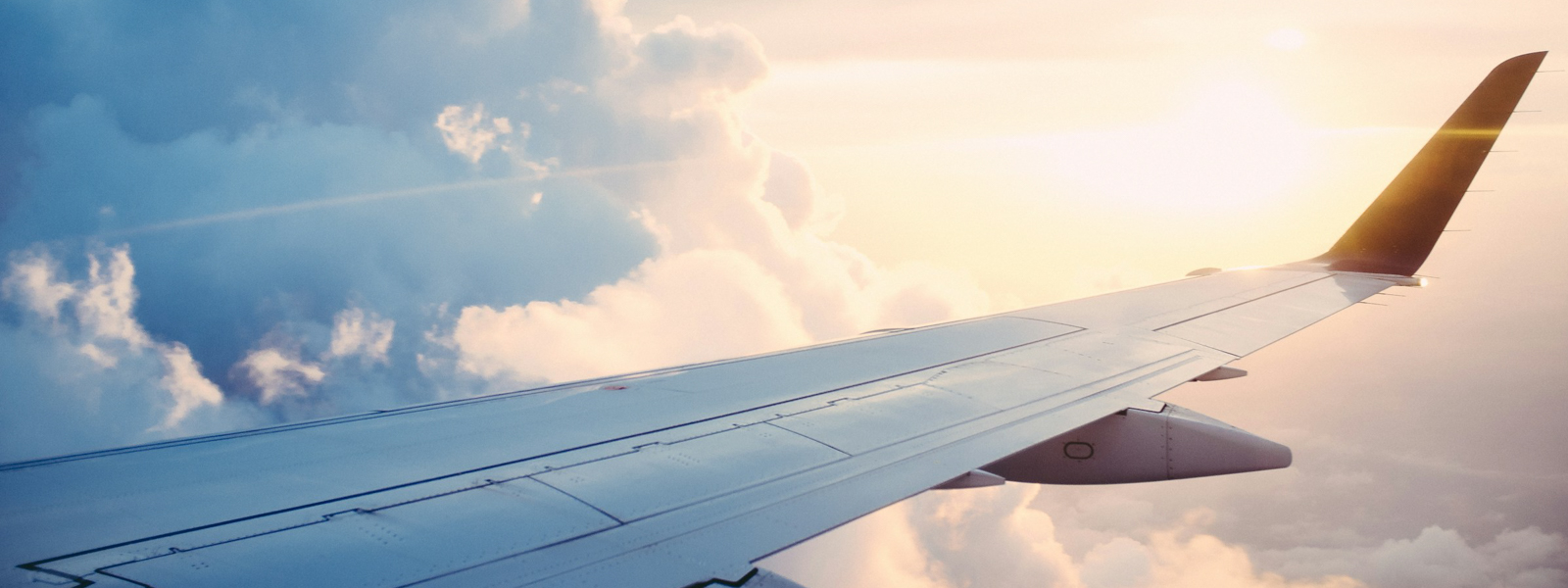 View of an airplane wing from inside the plane