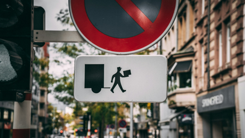 Colorful package delivery sign on city street