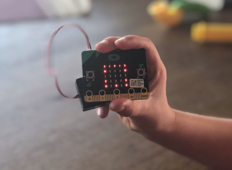 A micro:bit in a hand