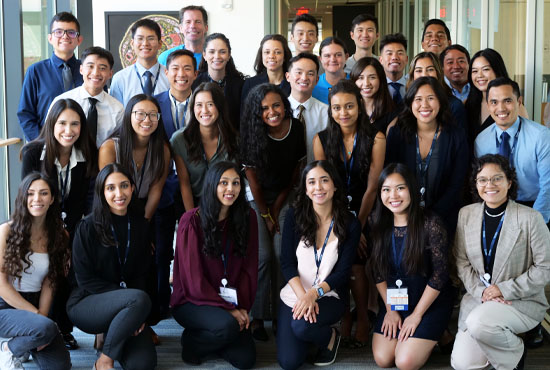 Group photo of students inside hallway of building