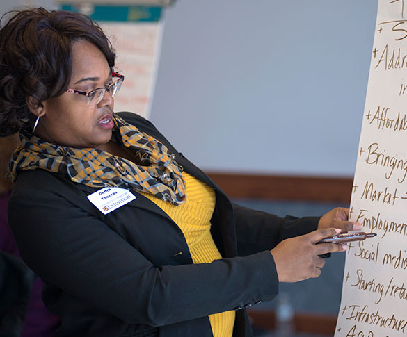 Extension staff member writing on flipchart