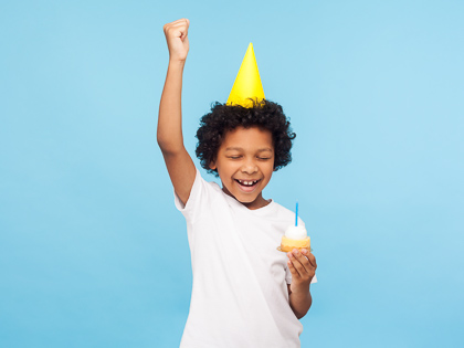 Birthday boy with cupcake