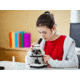 Girl Examining Specimen Under Microscope