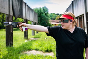 Woman Shooting in a Conventional Pistol Competition