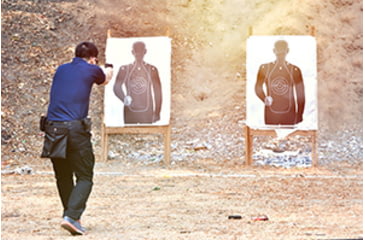 Image of Man firing at targets