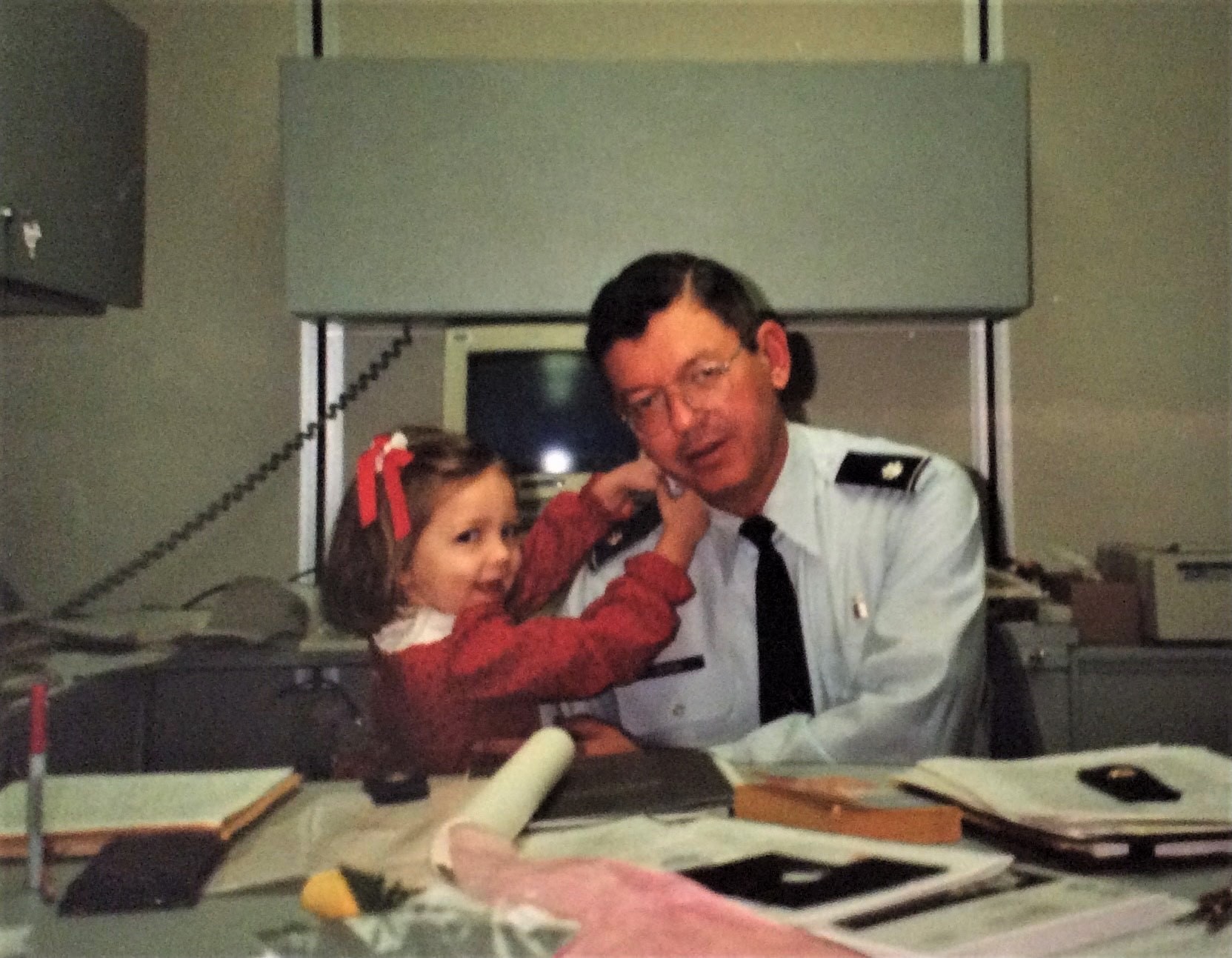 Child and parent at a desk.