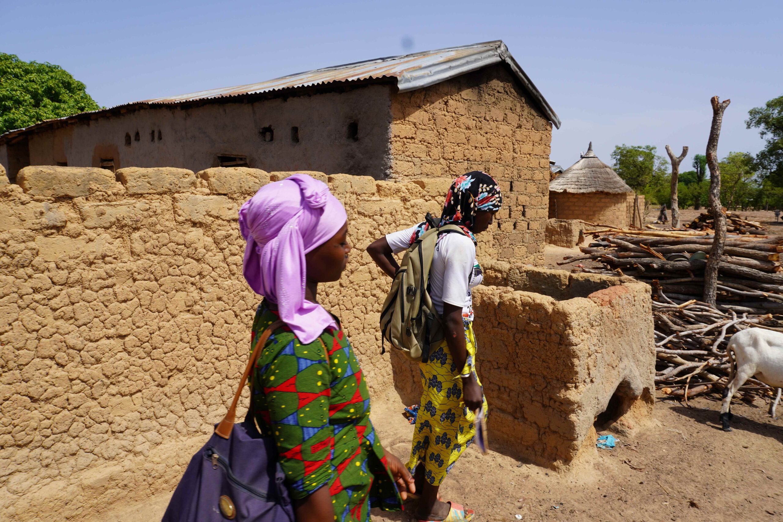 Mariam and her friend on their way to school.