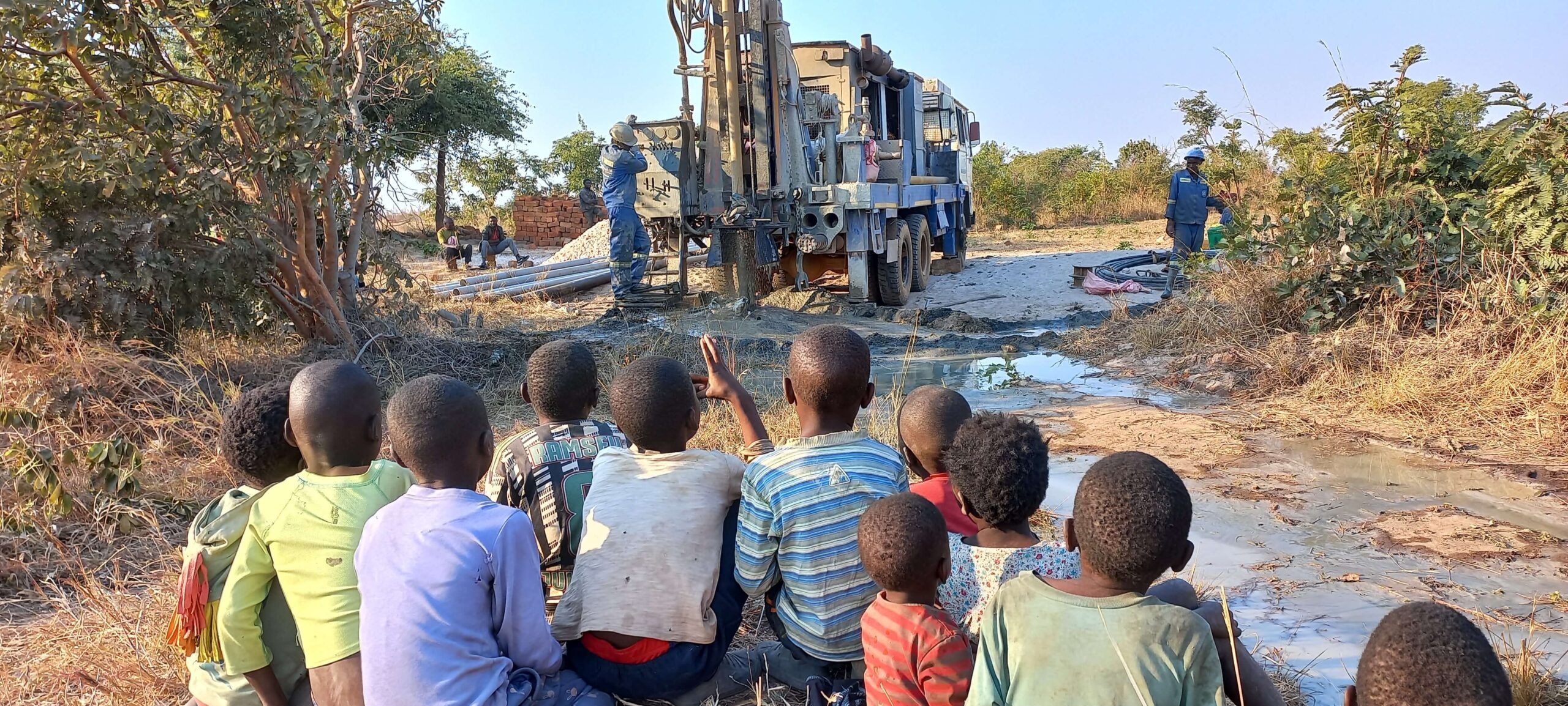 A large digger is drilling a borehole. 