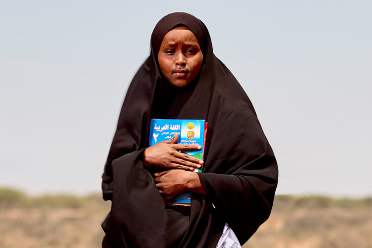 Girl holding book