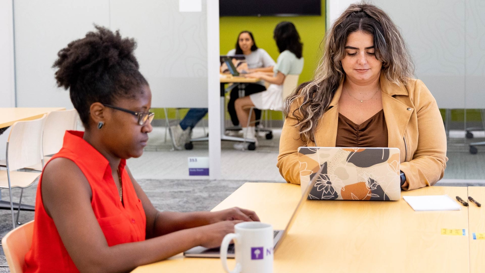 Students typing on laptops