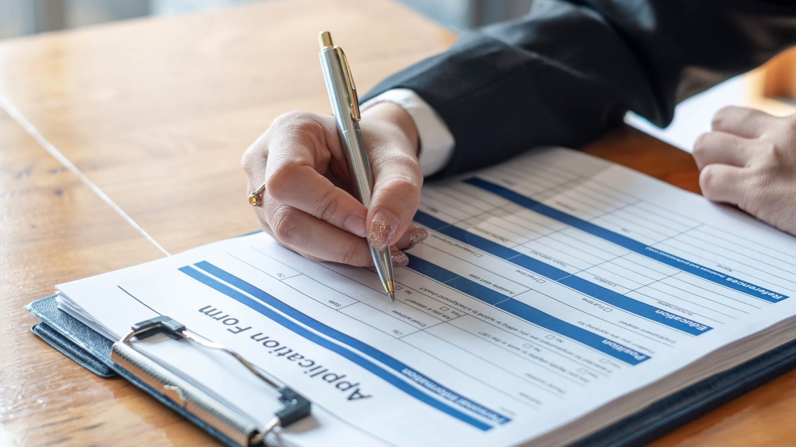 Woman filling out a paper form