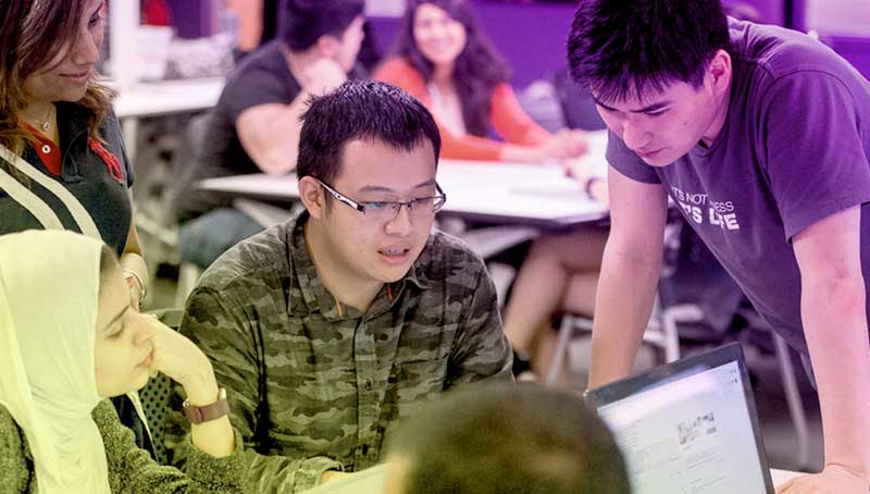 Students working around a table