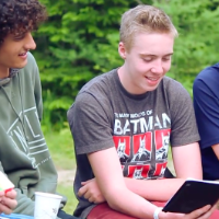 camper boys reading bible