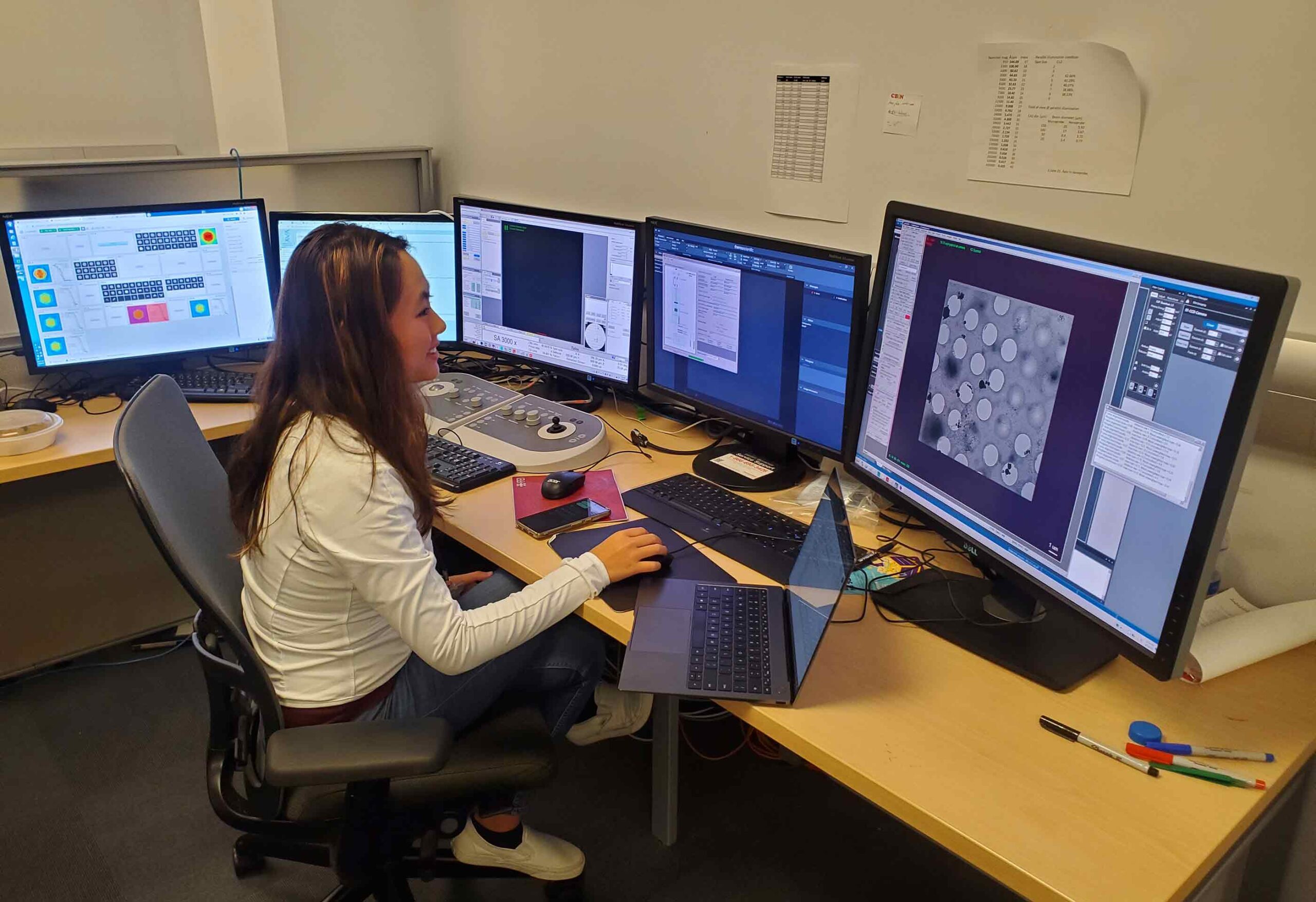 As part of her doctoral dissertation studies, Jennifer Jiang works in an electron microscope control room in the Rutgers CryoEM and Nanoimaging Facility. A new program being developed by the Rutgers-New Brunswick Office of the Chancellor will greatly expand the availability of such research opportunities for undergraduates, graduate students and non-degree students. Jiang is examining a protein that has been frozen through an advanced technique that employs a glassy form of water known as vitreous ice.
J. Kaelber/Rutgers CryoEM and Nanoimaging Facility