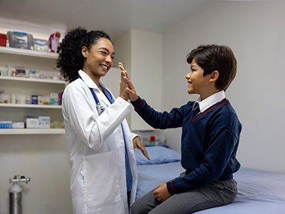 School nurse giving a student a high five