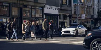 Medium waymo driver at crosswalk