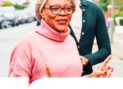 Older, dark-skinned woman smiling