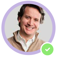 A smiling man with a purple circular border and a green check mark.