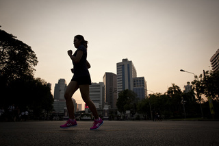 People exercising at Lumpini park in central Bangkok.