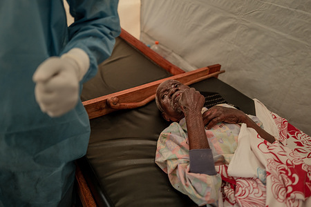 Christoph, 90, receives treatment after being hospitalised with mpox at the Nyiragongo General Reference Hospital, north of Goma in the Democratic Republic of the Congo (DCR) on 14 August 2024. On 14 August 2024, WHO Director-General Dr Tedros Adhanom Ghebreyesus determined that the upsurge of mpox in DRC and a growing number of countries in Africa constitutes a public health emergency of international concern (PHEIC) under the International Health Regulations (2005) (IHR). Related: https://www.who.int/news/item/14-08-2024-who-director-general-declares-mpox-outbreak-a-public-health-emergency-of-international-concern