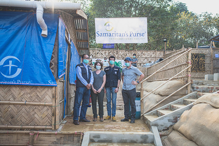 WHO staff with other partners at the logistics base, Cox's Bazar, Bangladesh