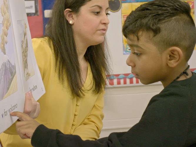 A child learning to read.