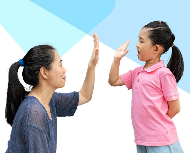 A parent high-fiving their child.