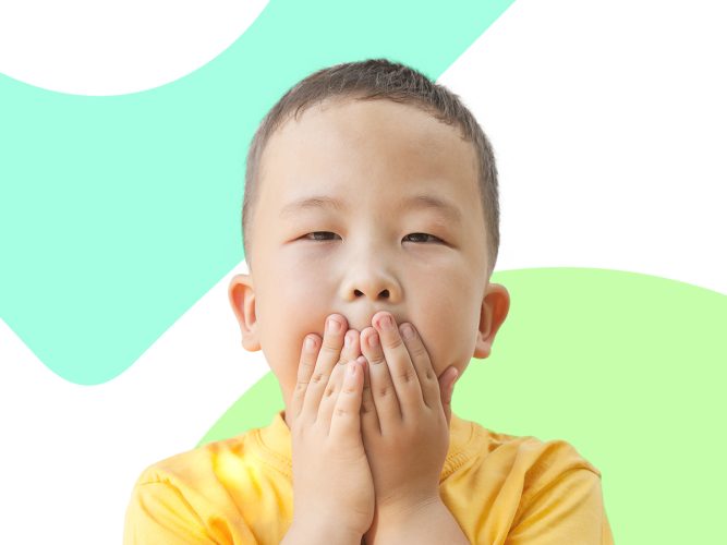 A child covering their mouth