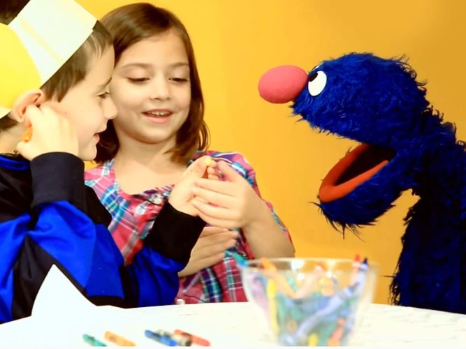 Grover playing with children.