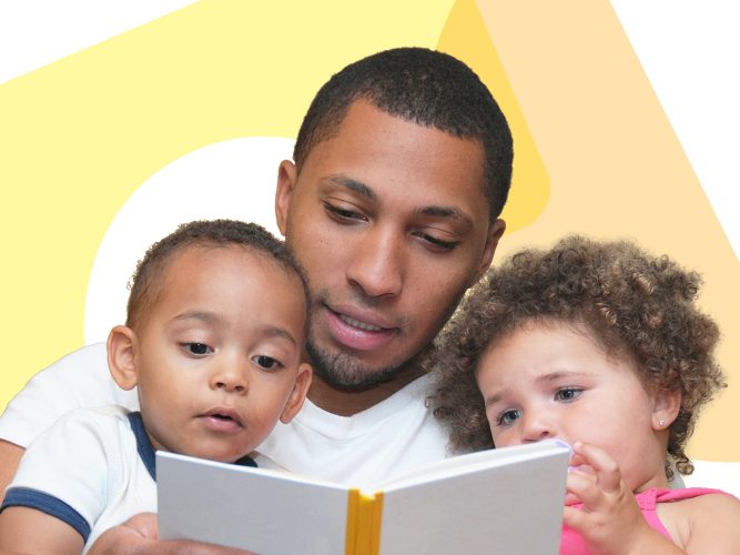 A parent reading to two children.