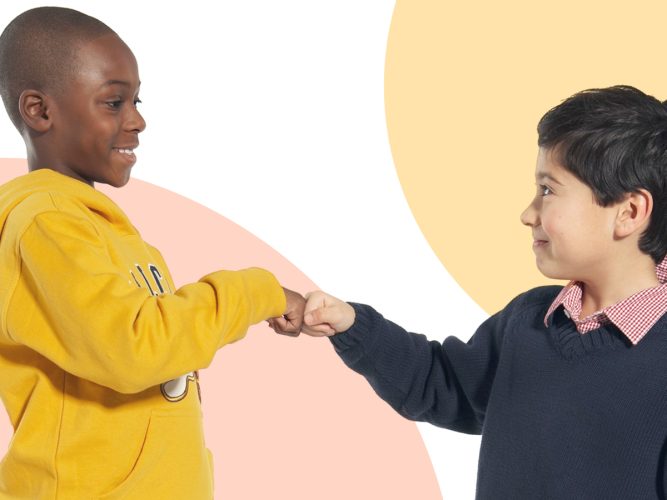 Two children fist bump