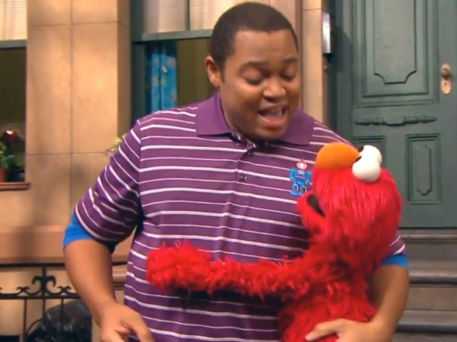 Elmo hugging Chris.