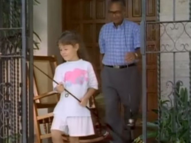 A child getting ready to go fishing with her Abuelo.