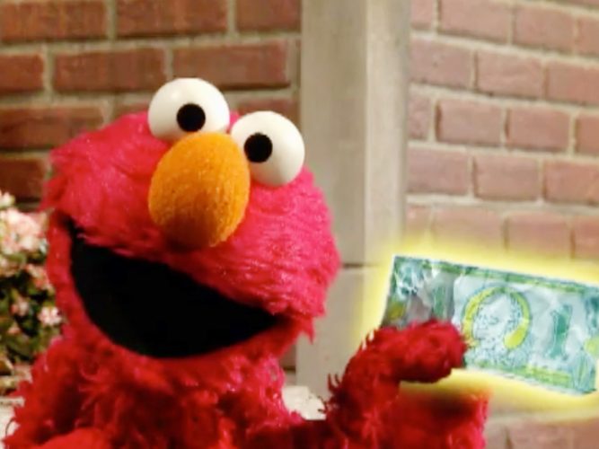 Elmo smiling and holding up a dollar