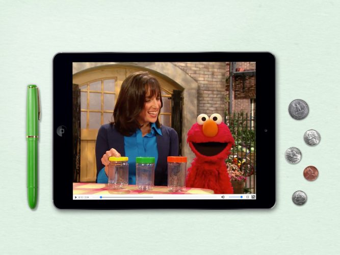 An iPad of Elmo talking about finances