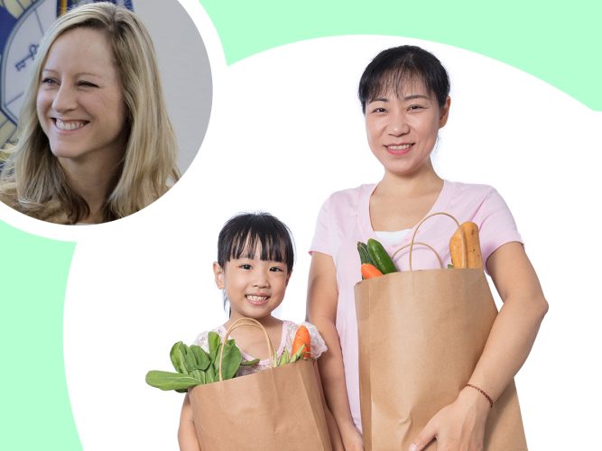 A parent and child holding shopping bags.