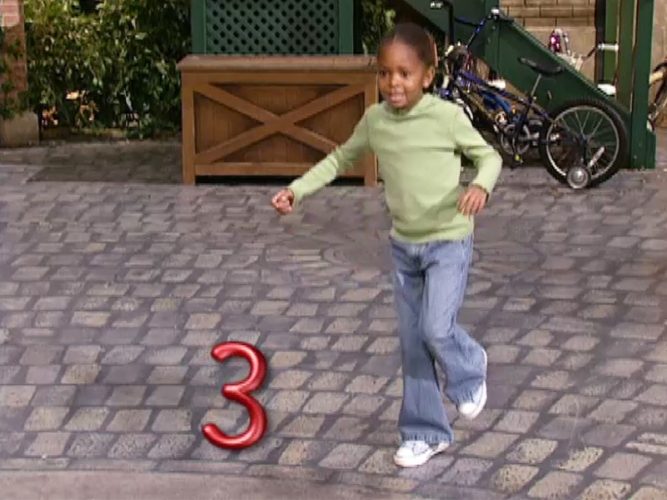 A child skipping with the number 3