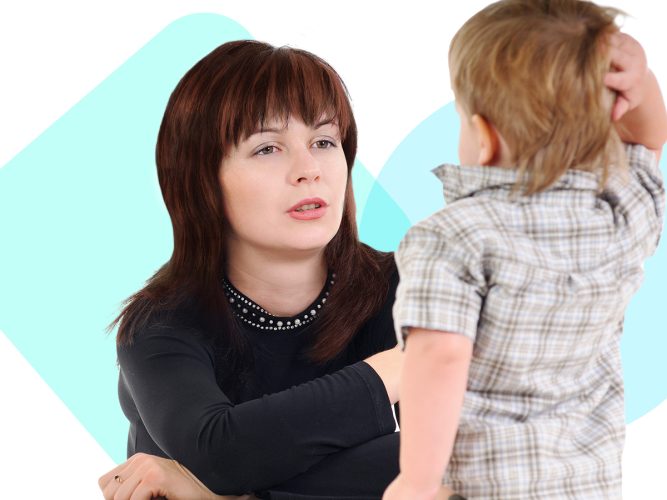 A caregiver talking to a child.