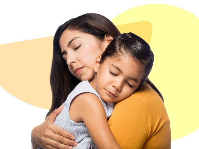 A child and caregiver hugging.