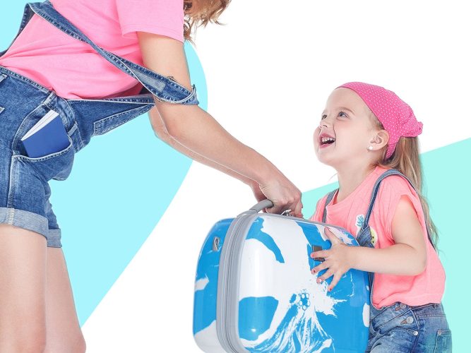 A parent handing a child their luggage.