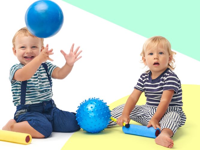 Two children play with bouncy balls